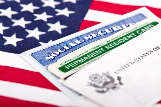 social security card and permanent resident on usa flag picture id454172307